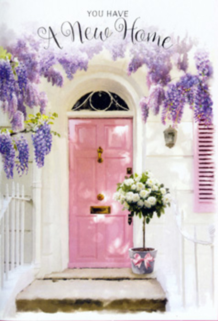 In this scene, a lovingly styled doorway is transformed into a floral welcome, reminiscent of the characterful homes tucked along the hills of Forest Hill near the Horniman Gardens. The central feature is a pastel pink door, its colour carefully chosen to evoke warmth, affection, and a hint of playful charm. Framing this door is an abundant sweep of wisteria that cascades downward in flowing, graceful strands. The wisteria's blossoms are composed of countless tiny flowers in shades of lavender, soft purple, and muted lilac, which appear almost perfumed just by looking at them. They hang against whitewashed walls that catch the light and provide a clean, bright contrast to the pastel tones. To the side of the door, a blush-painted shutter extends the colour palette across the façade, giving the whole entrance a cohesive, storybook quality. Resting on the front step is a sturdy grey metal bucket, used here as a rustic container for an artfully arranged bouquet. It brims with creamy white roses, each bloom full and rounded, their petals layered into gentle spirals that suggest freshness and care. Between the roses, soft green foliage is threaded, providing structure and natural movement while echoing the greenery of the surrounding neighbourhood. A satin pink ribbon is tied around the bucket's base, its loose bow draping over the stone as a subtle, decorative flourish that ties together the pink door, the roses, and the wisteria above. The lighting feels like late afternoon, calm and golden, with soft shadows that hint at a peaceful, residential street. This image captures the feeling of a thoughtful housewarming gift in Forest Hill-flowers left at the threshold to welcome someone into a new chapter, with tenderness and quiet celebration.